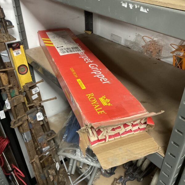 Box of Royale carpet gripper rods for flooring installation.