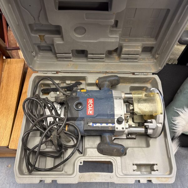 Ryobi ERT-2100V router in its original carrying case.