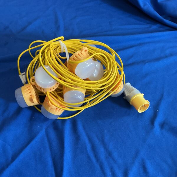 Yellow safety lights string for industrial or outdoor use.