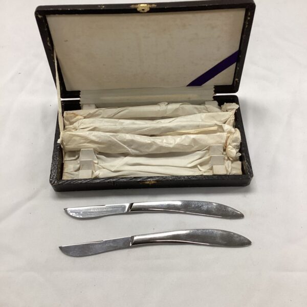 Vintage samurai steak knife set in wooden presentation box.