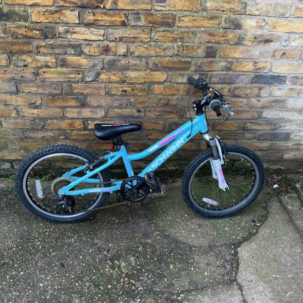 Blue Schwinn Cimarron child’s bike, mountain bike style.