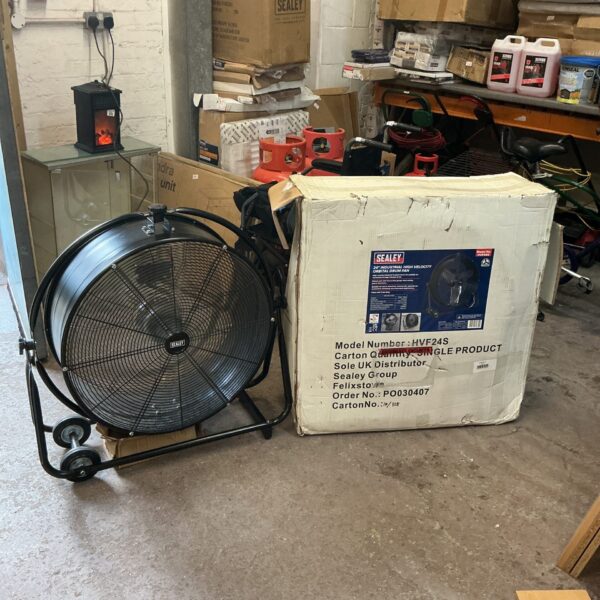 Sealey 24 inch industrial drum fan in workshop setting.