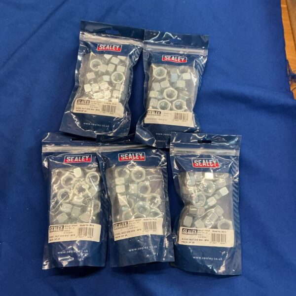 Five bags of Sealey Din 935 M16 steel nuts for workshop use.