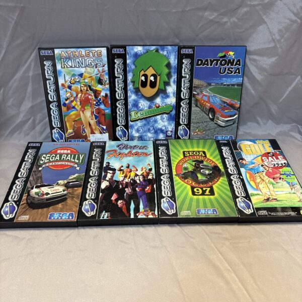 Sega Saturn games lot featuring Athlete Kings, Lemmings, Daytona USA and more.