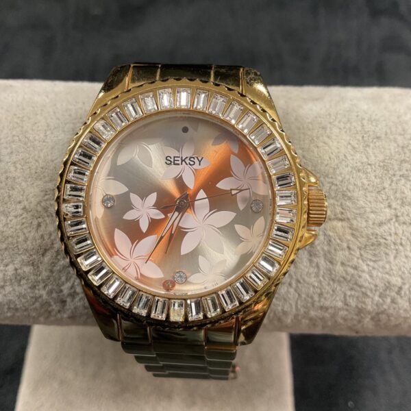 Gold tone Sekonda Seksy quartz wristwatch with floral dial.