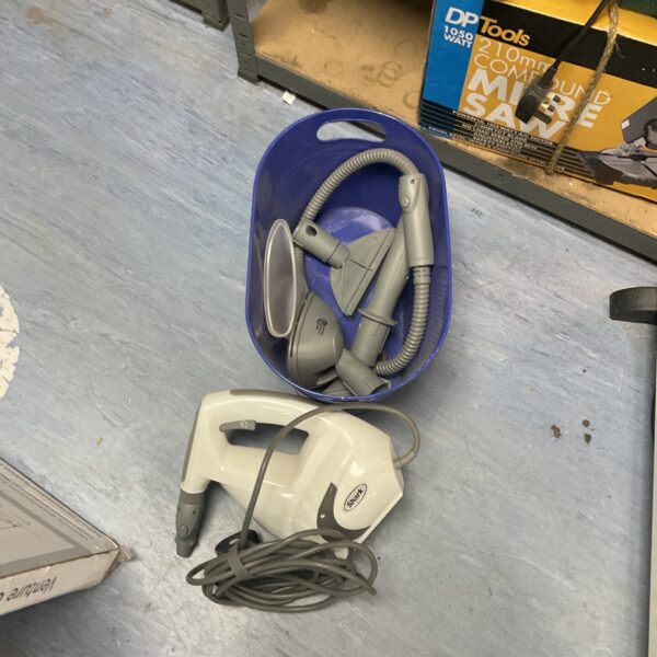 Shark steam cleaner machine with hose and attachments for floor and upholstery cleaning.