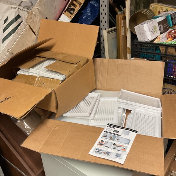 Stack of new clear plastic shoe boxes in original packaging.