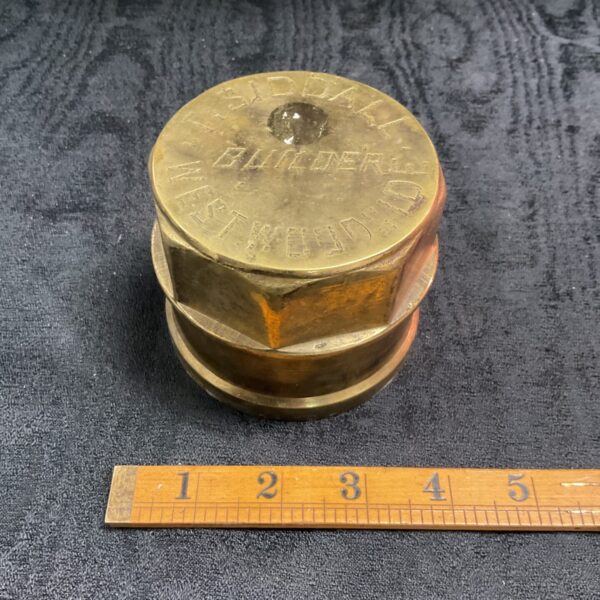 Vintage brass Siddall cartwheel hub cap with raised lettering.