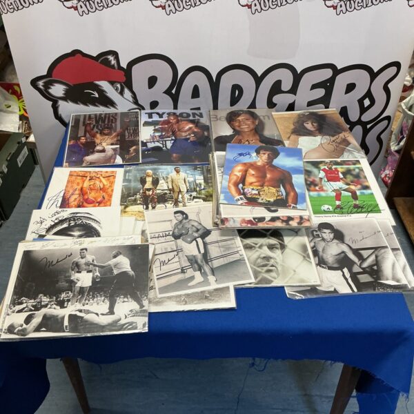 Collection of signed prints featuring Muhammad Ali and other celebrities.