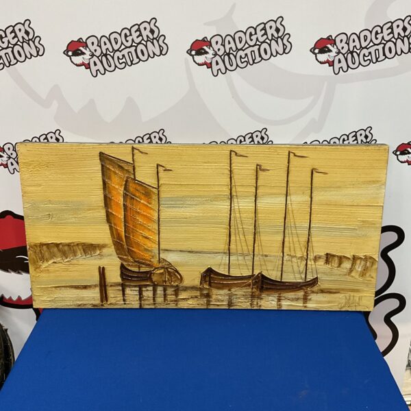 Signed sailboat painting of a harbor scene with docked boats.