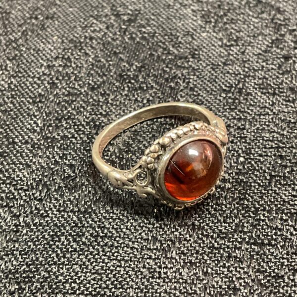 Vintage silver ring with a floral amber cabochon.