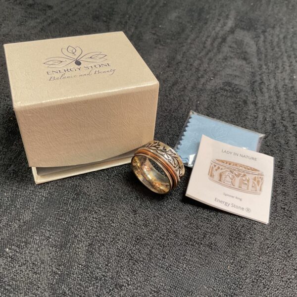 Silver energy stone ring with spinning bands, size W.