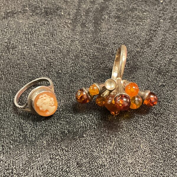 Antique silver necklace with camel pendant and amber beads.