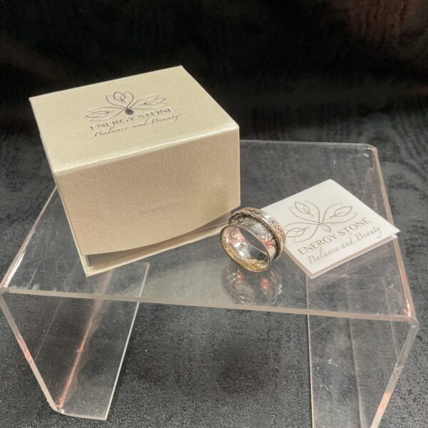 Silver spinner ring size O with rotating band.