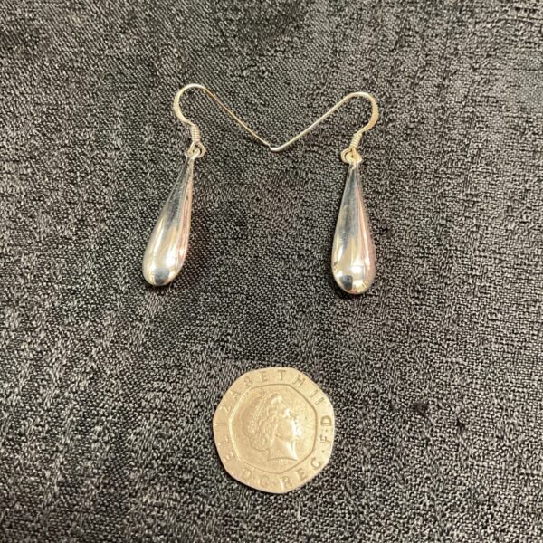 Delicate silver teardrop earrings, classic drop style.