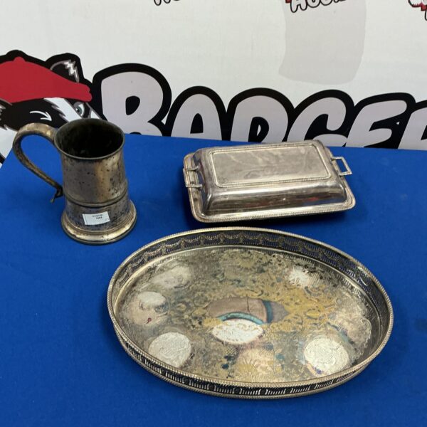 Vintage silverplate collection featuring a tray and tankard.