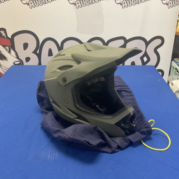 Front view of a used Sixsixone motocross helmet.