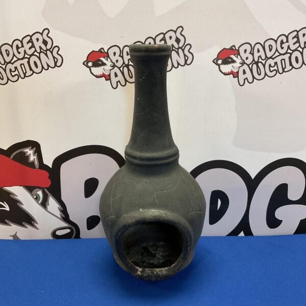 Small cast iron chiminea for garden heating and decoration.