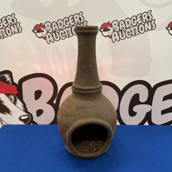 Small cast iron chiminea for garden heating and outdoor ambiance.