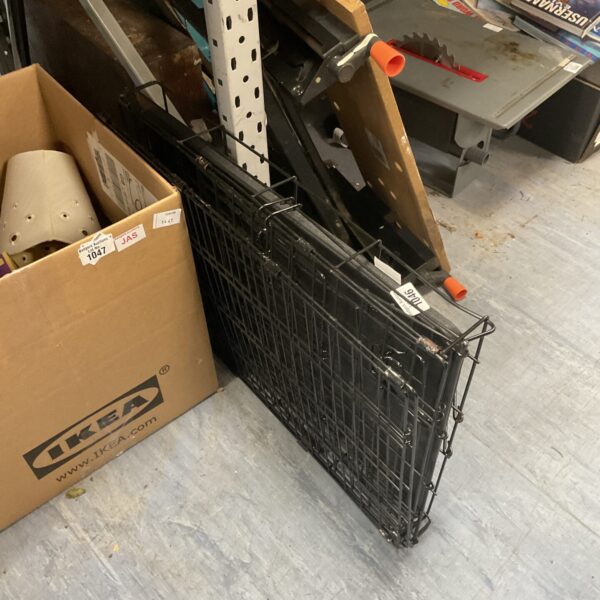 Used small wire pet cage with a handle for animal transport.