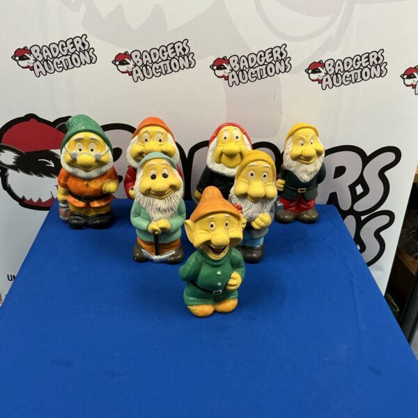 Group of vintage Snow White Seven Dwarfs figurines.