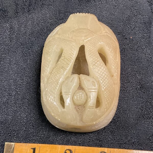 Detailed vintage soapstone scarab figure with hieroglyphs.