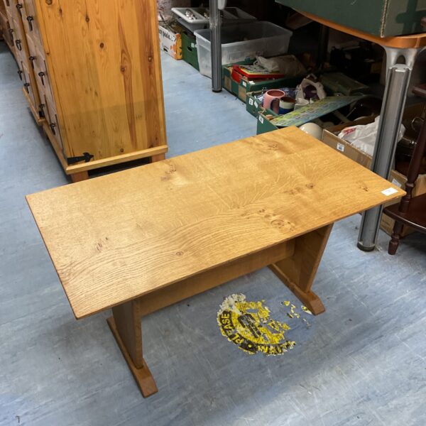 Rustic solid oak coffee table in a living room setting.