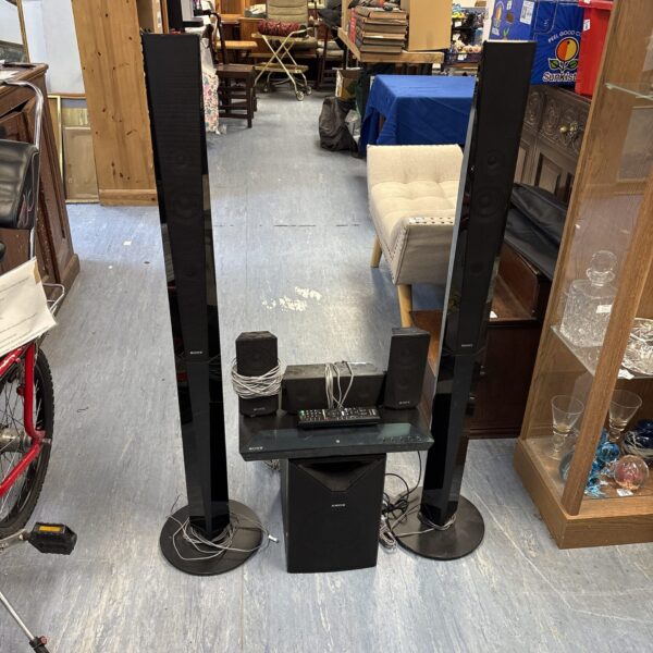 Front view of a used Sony home theatre system with tall speakers.