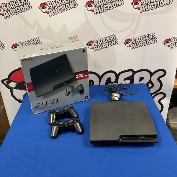 Black Sony Playstation 3 console with two controllers.