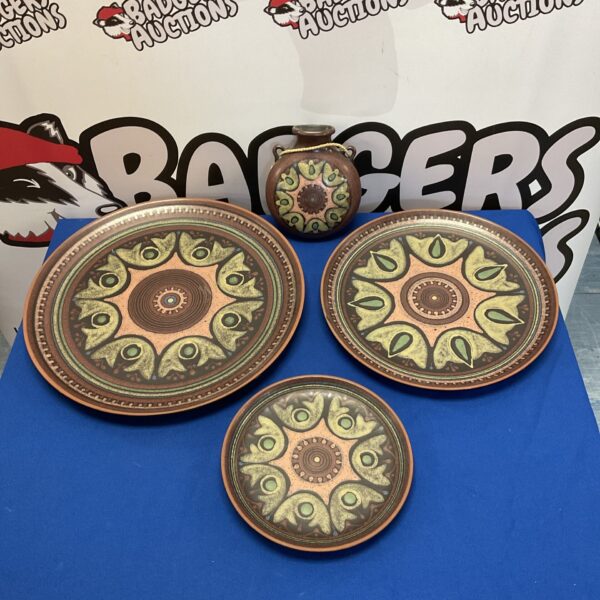 Set of antique Spanish Porta Celi plates with hand-painted designs.