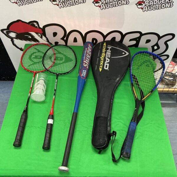 Sports rackets and a Louisville Slugger baseball bat in a lot.
