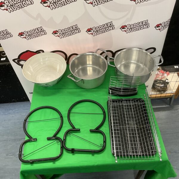 Stainless steel pots, draining rack, and fruit bowl kitchen lot.