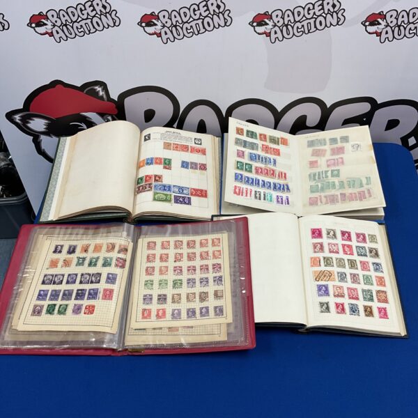 Vintage stamp collection albums with Victorian Penny Red stamps.