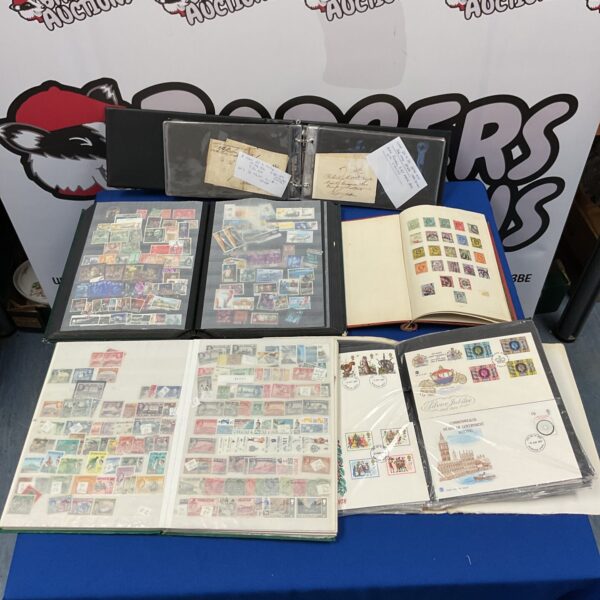 Vintage stamp collection albums with first day covers.