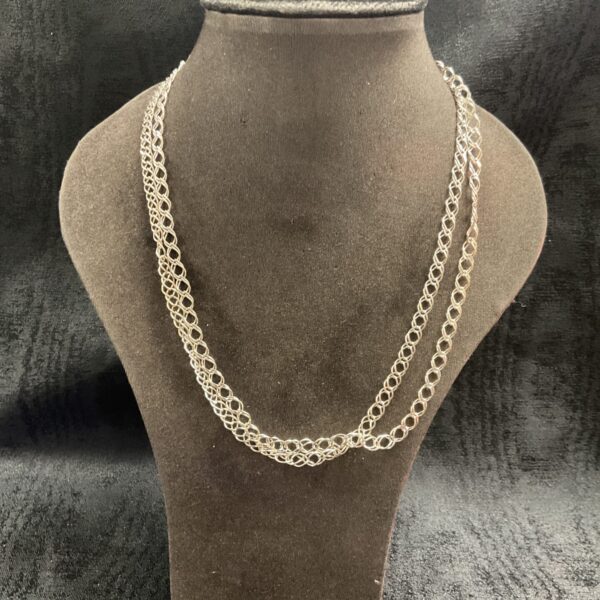 Two heavy sterling silver double curb chain necklaces on display.