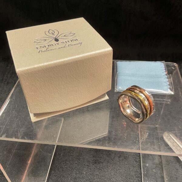 Sterling silver spinner ring with copper bands, size U.