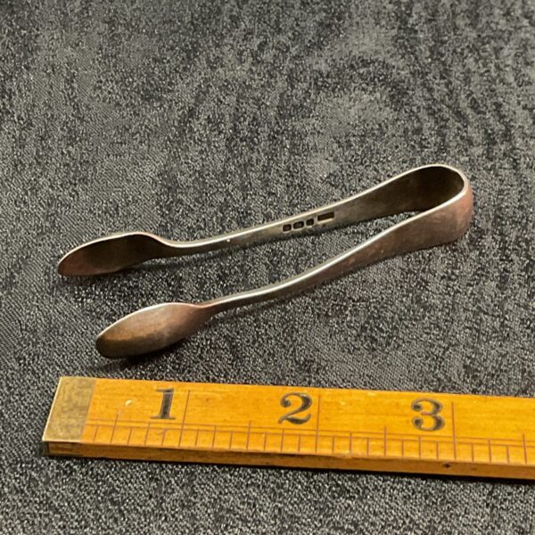 Vintage sterling silver sugar tongs, hallmarked and elegant.