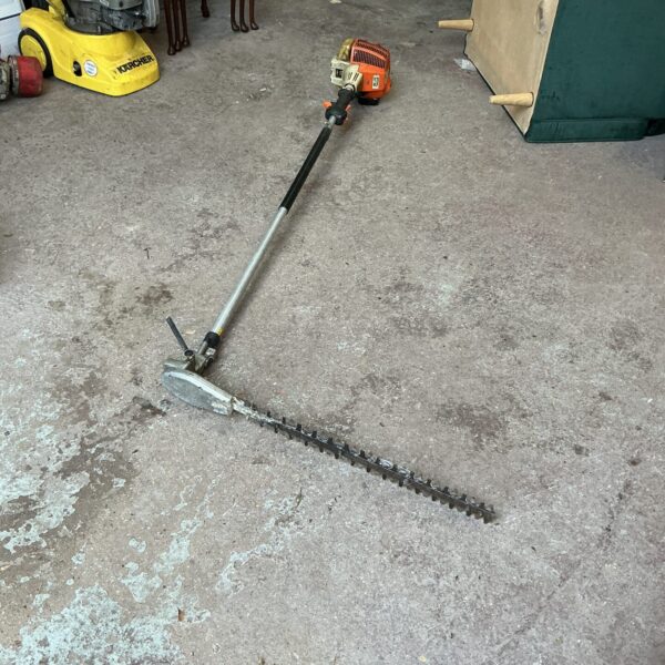 Used Stihl petrol hedge cutter for garden maintenance.
