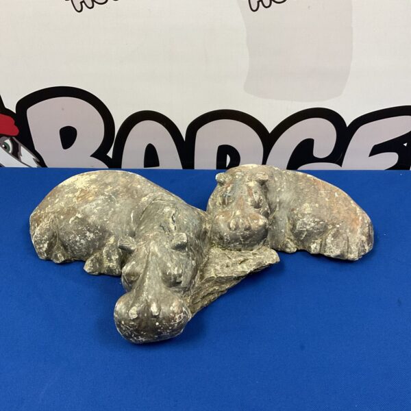 Detailed stone hippopotamus sculpture, a unique collectible.