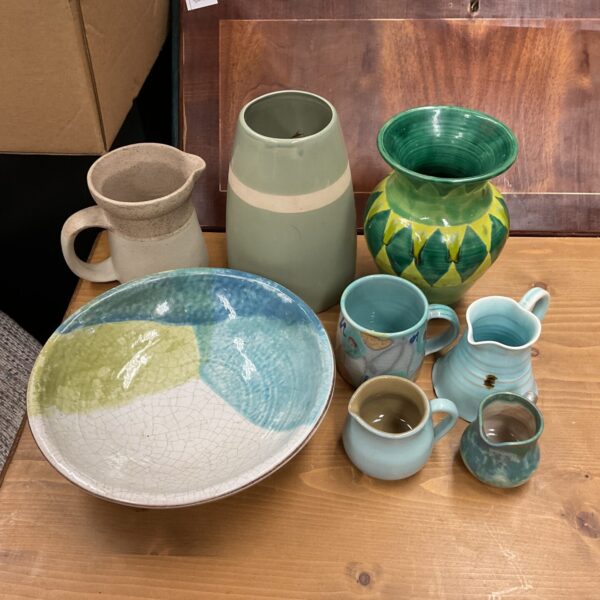 Vintage studio pottery collection featuring colourful vases and jugs.