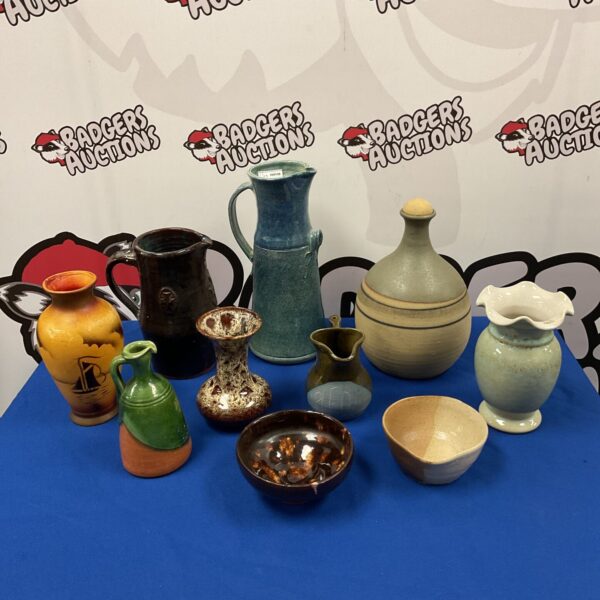Vintage studio pottery collection featuring jugs and vases.