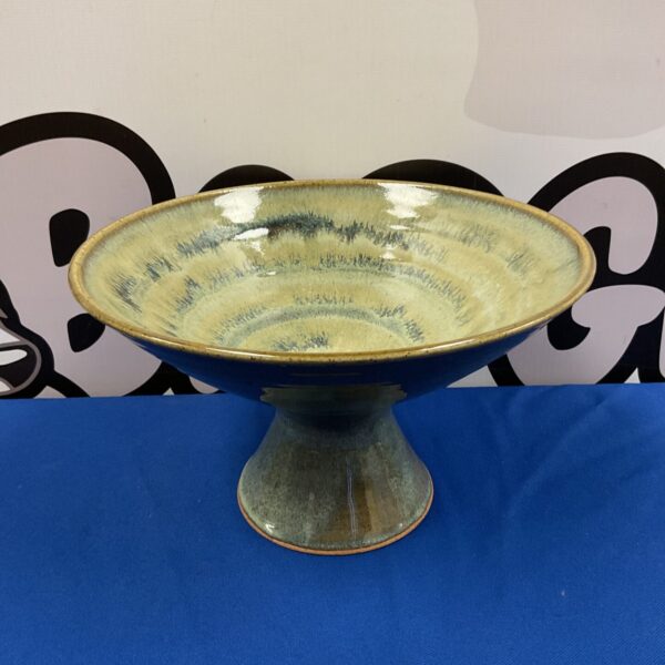 Vintage studio pottery pedestal bowl with green glaze.