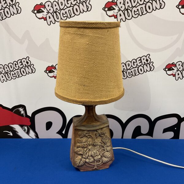 Vintage studio pottery table lamp with detailed fauna design.
