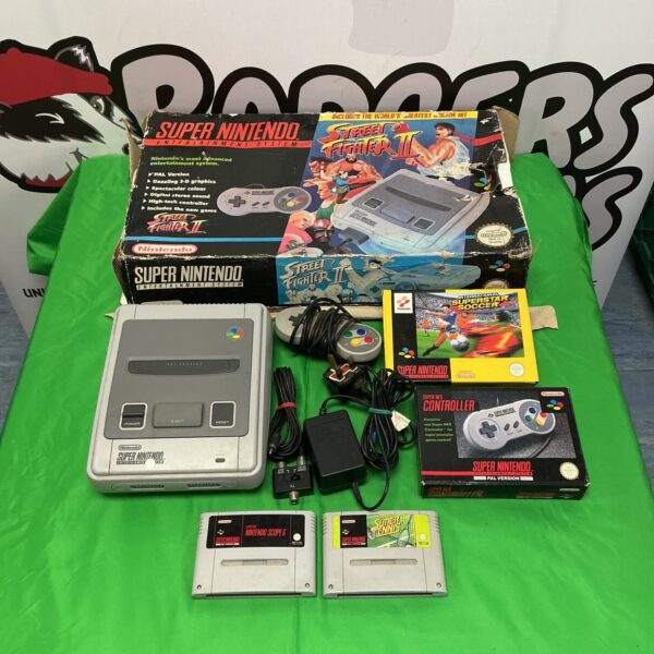 Super Nintendo SNES console with games and cables, PAL version.
