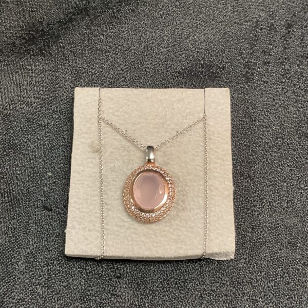 Elegant Swarovski pink stone pendant necklace with crystals.