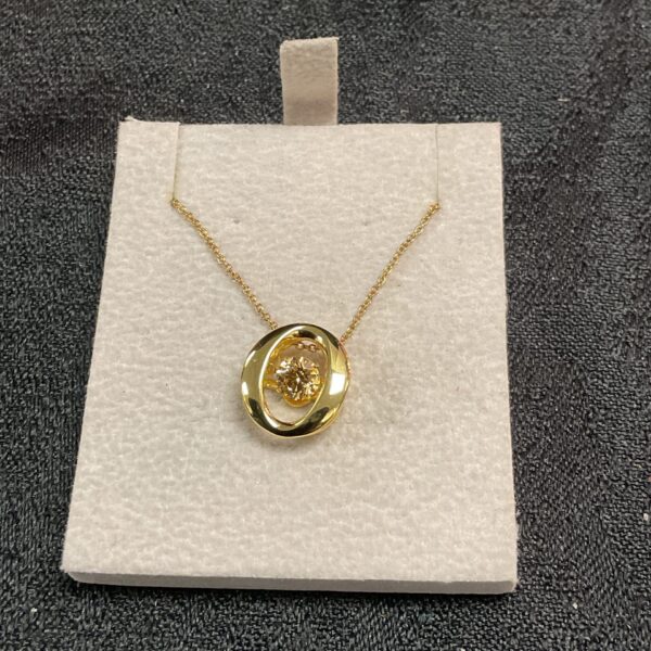 Close-up of the Swarovski shimmerstone pendant necklace on a display pad.