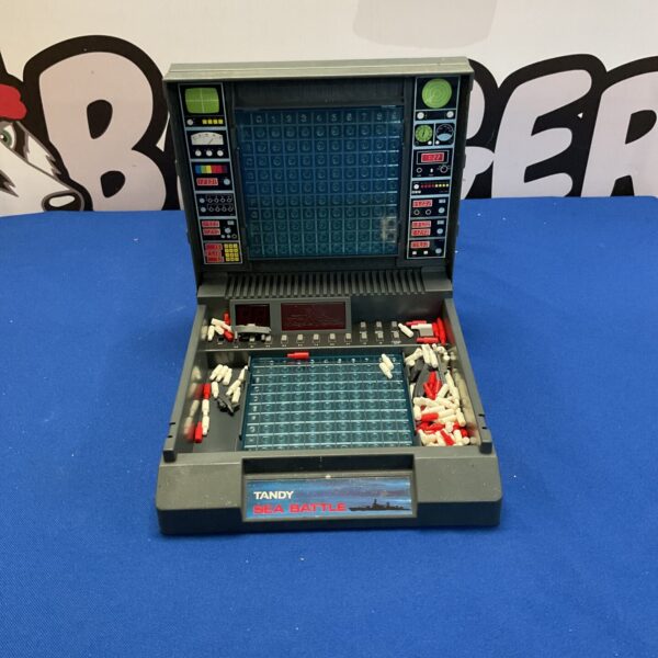 Vintage Tandy Electronic Sea Battle handheld game with buttons.