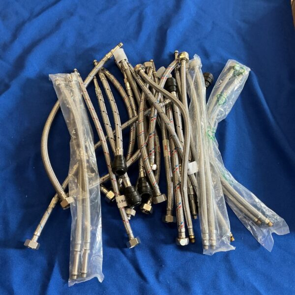 Lot of flexible tap connector pipes for plumbing projects.