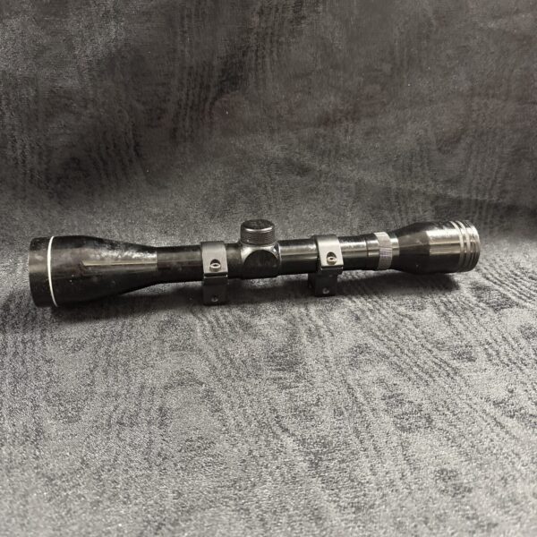 Vintage Tasco 4x40 rifle scope for hunting and firearms.