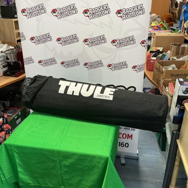 Black Thule Ranger 90 roof box on a display table.